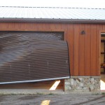 Storm-Damaged-rollup-door - Gallery - al garage door solutions (pty) ltd - al garage door suppliers - western cape garage doors - garage door repair near me - garage door installation